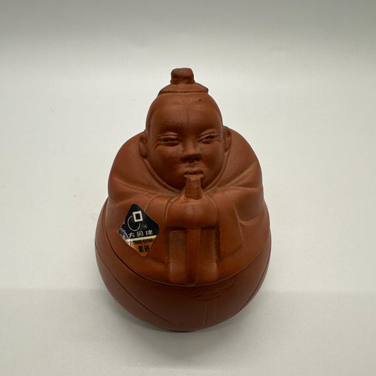 Purple Clay tea caddy (man playing flute)